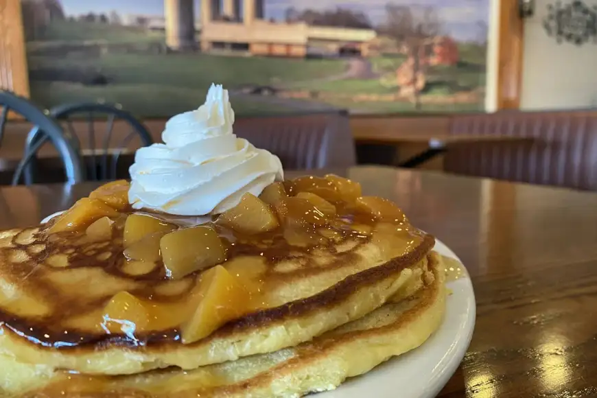 Apple pancakes with whipped cream and caramel sauce at The Restaurant at Oregon Dairy in Lancaster PA