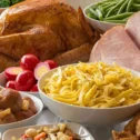 Pennsylvania Dutch smorgasbord spread with turkey, ham, buttered noodles, and traditional sides at Bird-in-Hand Restaurant Lancaster PA