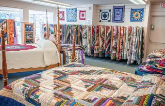 Amish handmade quilts on display at a quilt shop in Lancaster County PA