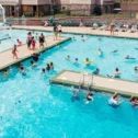 Outdoor swimming pool with water feature and lifeguard at Refreshing Mountain resort in Stevens Lancaster County PA