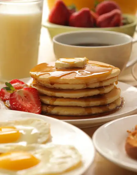 Hershey Farm Restaurant Sunday brunch pancakes with eggs and strawberries - Lancaster PA