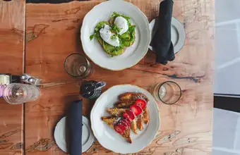 Per Diem Restaurant Sunday brunch overhead flatlay with eggs benedict and roasted tomatoes - Lancaster PA