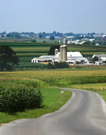 Scenic Amish country road with farm and silo in Lancaster County PA