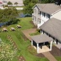 Aerial view of an Amish country homestead with gardens and pond on a guided tour in Lancaster County PA
