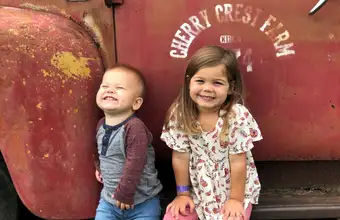 Two young children smiling at Cherry Crest Farm, family attraction in Lancaster PA