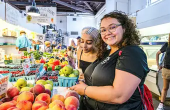Shoppers browsing fresh fruit and produce at a Lancaster PA farmers market