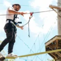 Man on a high ropes course and zipline adventure at Refreshing Mountain in Stevens Lancaster County PA
