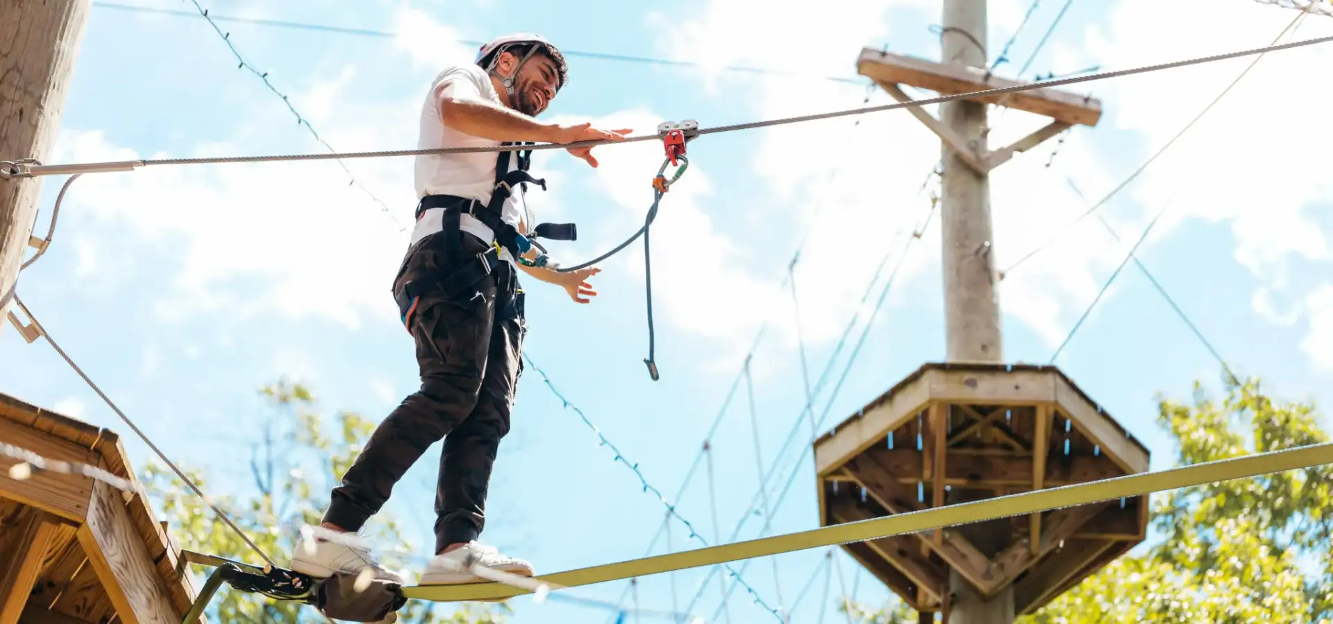 Man on a high ropes course and zipline adventure at Refreshing Mountain in Stevens Lancaster County PA