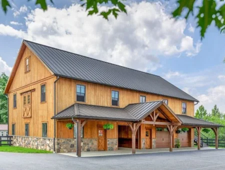 A & E Builders LLC barn-style home remodel in Lancaster PA with wood siding and metal roof