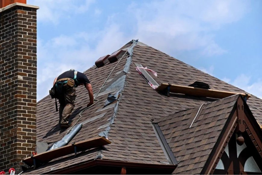Abel & Son Roofing and Siding contractor removing old shingles during roof replacement in Lancaster PA
