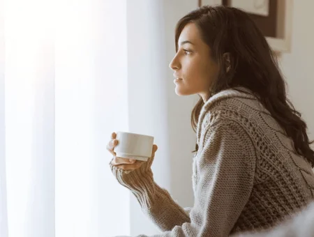Align Pregnancy Services woman holding coffee cup reflecting while seeking pregnancy support in Lancaster PA