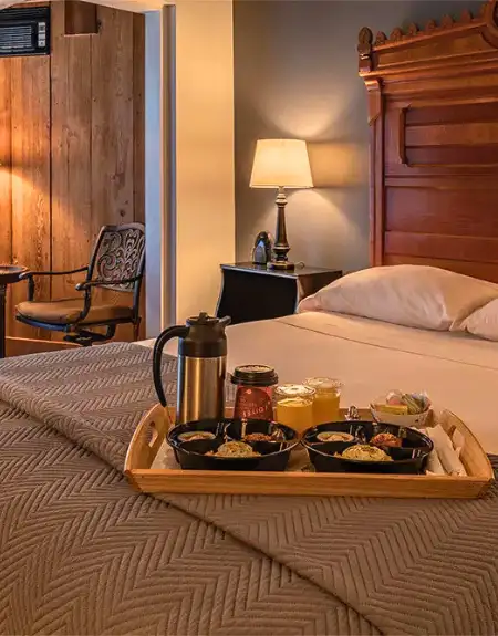 Cozy lodging room with breakfast tray service at Twin Pine Manor in Lancaster PA