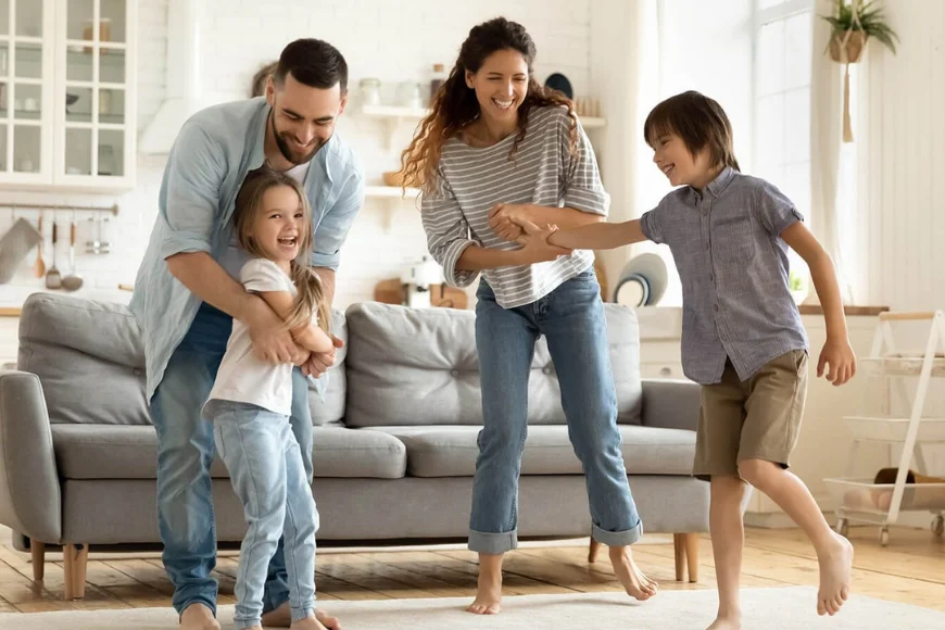 Ally Heating and Cooling Lancaster PA family playing comfortably at home with kids in living room