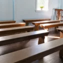 Amish meetinghouse interior with wooden benches in Lancaster PA Pennsylvania Dutch Country