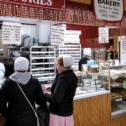 Amish bakery stand with sticky buns and fresh baked goods at Green Dragon Market in Lancaster PA