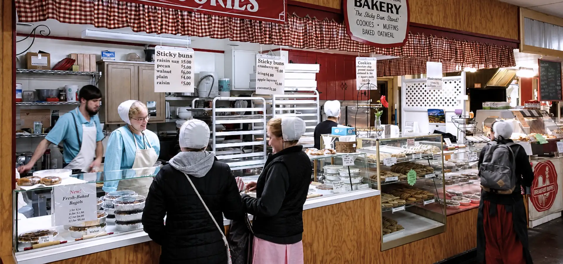 Amish bakery stand with sticky buns and fresh baked goods at Green Dragon Market in Lancaster PA