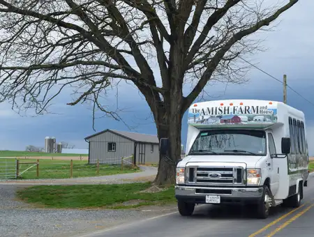 Amish Farm and House tour van driving through Lancaster County PA countryside on guided Amish tour