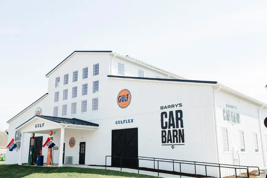 Exterior of Barry's Car Barn Antique Car Museum with vintage Gulf gas pumps in Lancaster PA