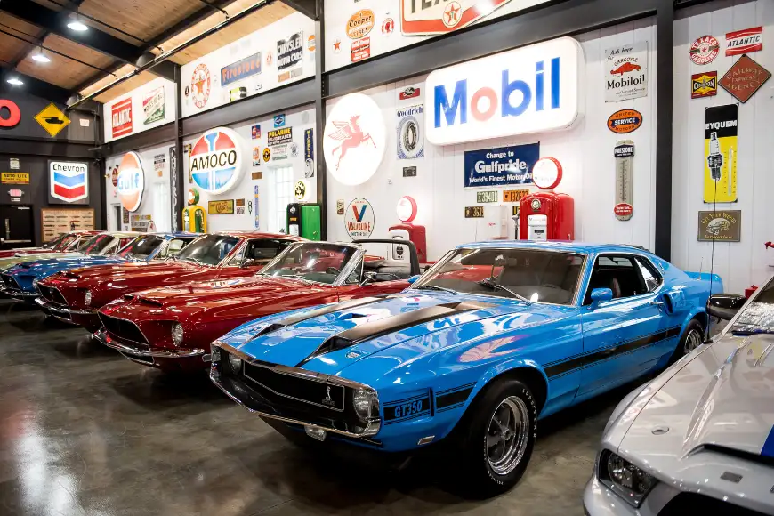 Classic muscle cars including a Shelby GT350 on display at Barry's Car Barn Antique Car Museum in Lancaster PA