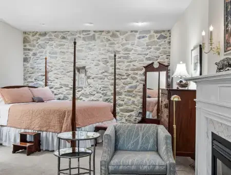 Bed and breakfast suite with stone wall and fireplace at Pheasant Run Farm in Lancaster PA