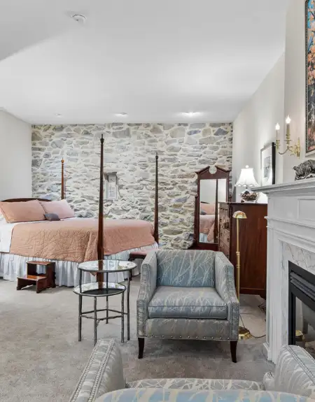 Bed and breakfast suite with stone wall and fireplace at Pheasant Run Farm in Lancaster PA