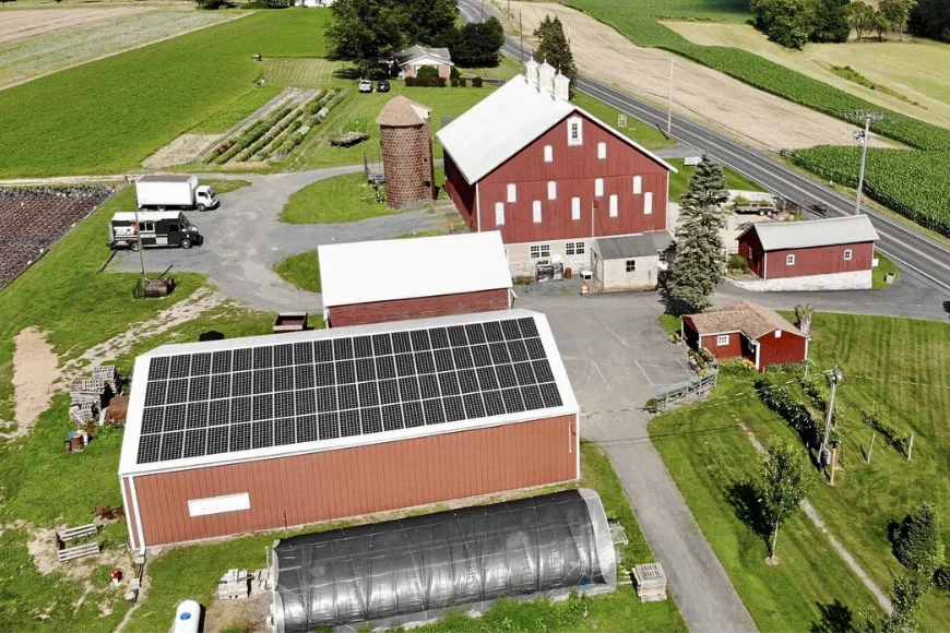 Belmont Solar aerial view of solar panel installation on red barn roof at Lancaster PA farm