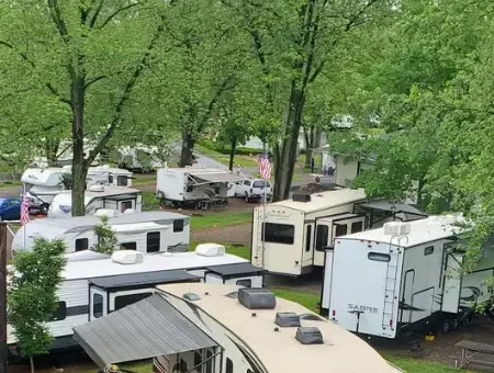 RV campground with wooded sites at Old Mill Stream Campground in Lancaster PA