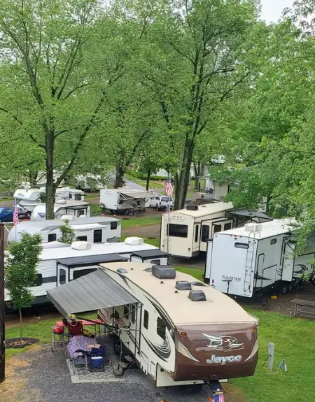 RV campground with wooded sites at Old Mill Stream Campground in Lancaster PA
