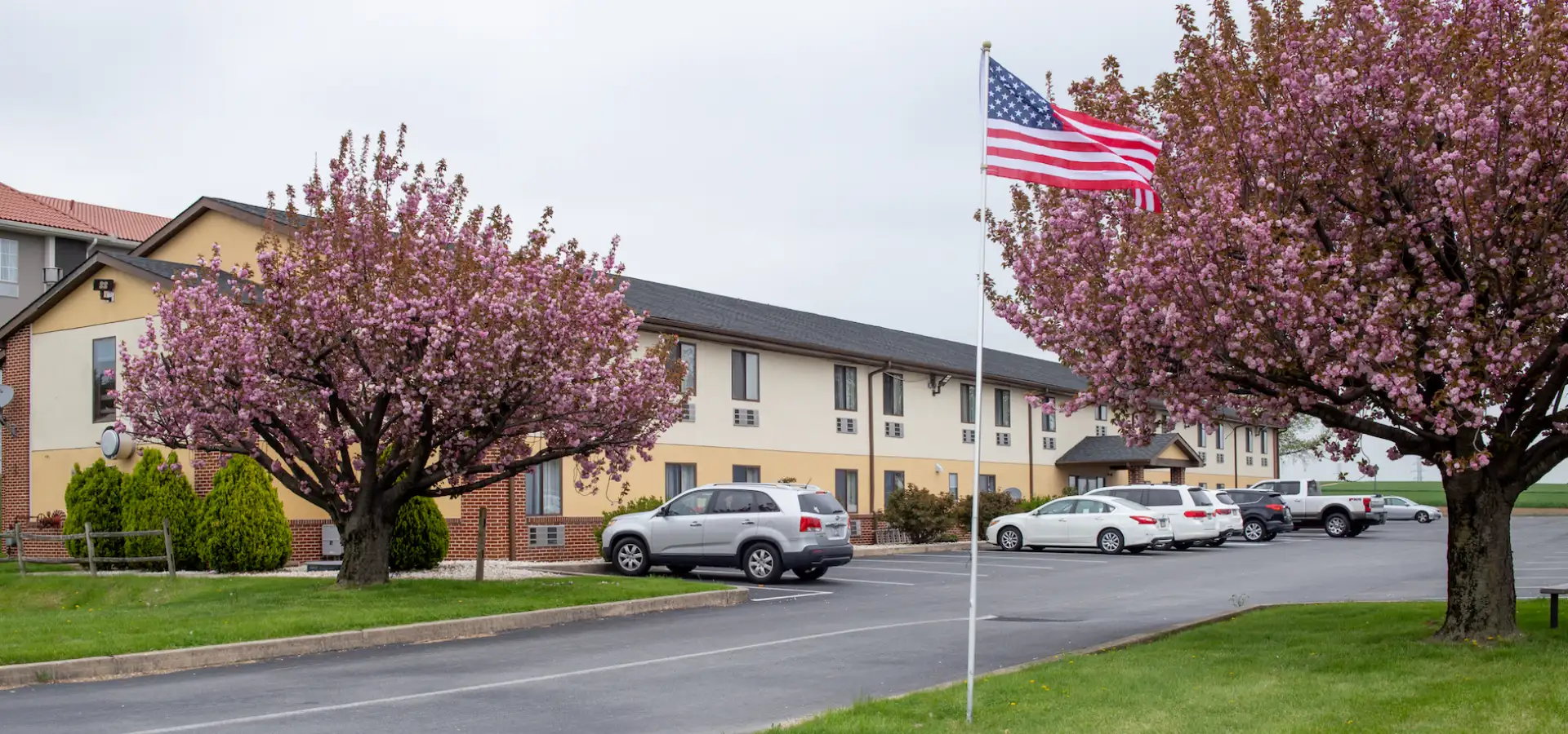 Affordable hotel exterior with spring blooms at Eastbrook Inn in Lancaster PA