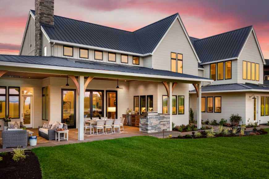 Choice Home Remodeling white farmhouse addition with metal roof covered porch and outdoor living space in Lancaster PA