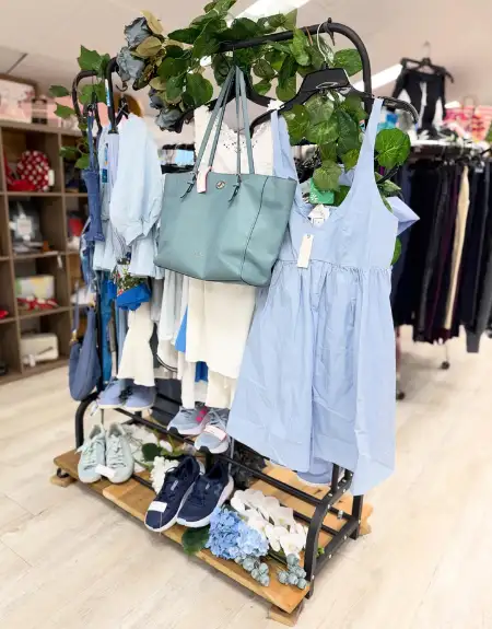 Boutique clothing rack with dresses and handbags at Fashion Cents clothing store in Lancaster County PA