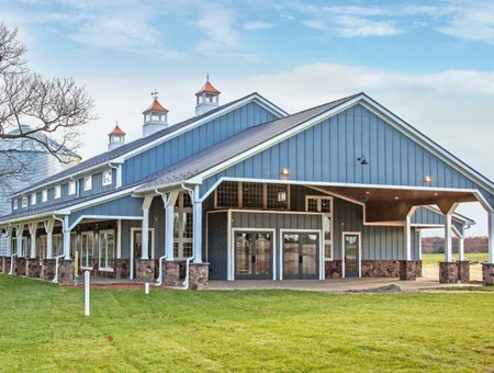 Conestoga Buildings custom blue metal commercial barn with cupolas and covered porch in Lancaster PA