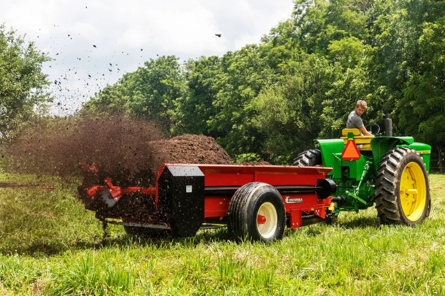 Conestoga Manufacturing manure spreader pulled by John Deere tractor spreading in Lancaster PA farm field