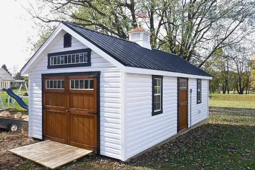 Country Tyme Sheds white vinyl shed with black metal roof wood carriage doors and cupola in Lancaster PA