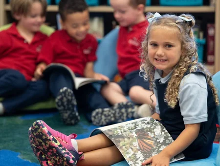 Young student in uniform reading during class at Dayspring Christian Academy private school in Lancaster PA