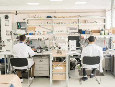 Engineers working at lab benches in precision manufacturing facility at Delserro Engineering Solutions in Lancaster PA