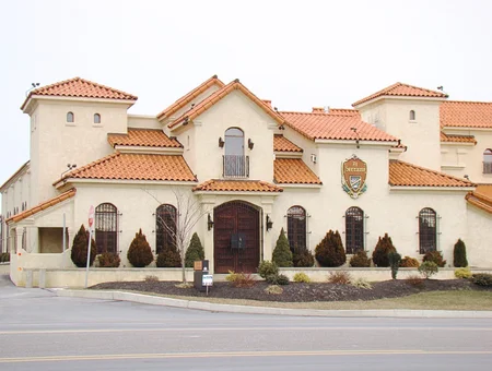 Custom built Mediterranean style home with terracotta roof and stucco exterior by DK Builder LLC in Lancaster PA
