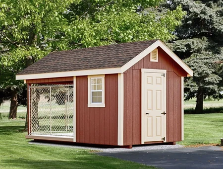 Custom red wood dog kennel shed with attached outdoor run from The Dog Kennel Collection in Lancaster PA