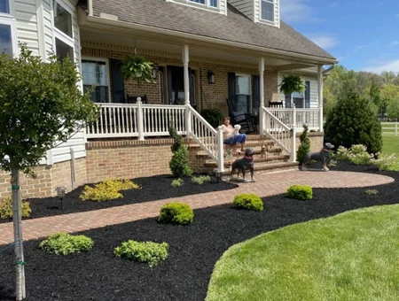 Front yard mulching and landscape bed installation with black mulch and shrubs by DWD Landscaping in Lancaster PA