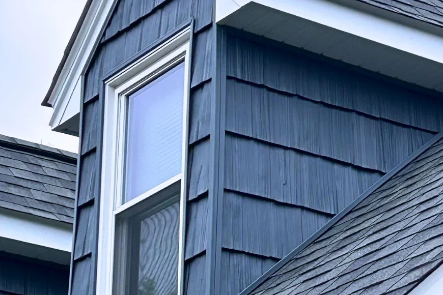 Navy blue shake siding and window installation on residential home exterior by Easy Siders Home Improvement in Lancaster PA