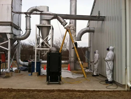 EHC Associates environmental hazard control workers in protective suits performing industrial remediation in Lancaster PA