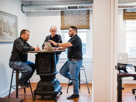 Digital marketing team meeting with blue collar business clients at E-Impact Marketing in Lancaster PA