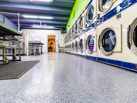 Commercial epoxy floor coating installation in laundromat with flake finish by Epoxy Floor Experts in Lancaster PA