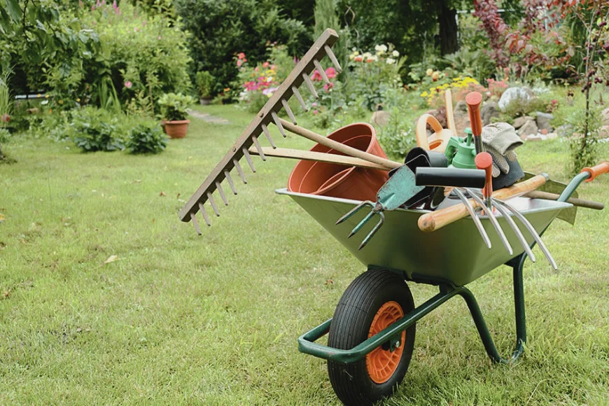 Wheelbarrow filled with garden tools and supplies for landscaping projects from Eshbach Mulch Products in Lancaster PA