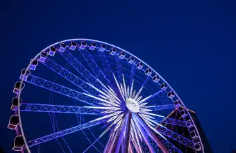 Illuminated Ferris wheel at Lancaster County PA fair or festival at night