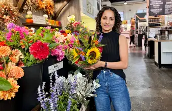 Woman holding fresh cut flowers at Lancaster County PA farmers market