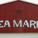 Red barn flea market sign at Lancaster County PA outdoor flea market