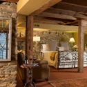 Rustic luxury getaway suite with stone walls and soaking tub at Inn at Leola Village in Lancaster PA