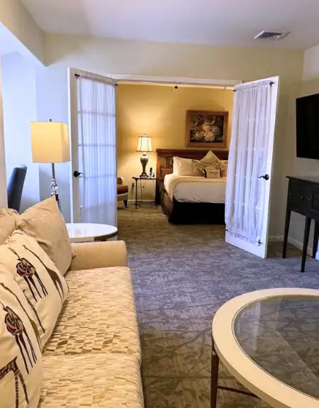 Hotel suite with separate living room and bedroom at Inn at Leola Village in Lancaster PA
