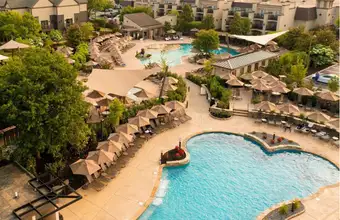 Aerial view of resort pool with lounge chairs and umbrella cabanas at Eden Resort in Lancaster PA